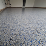 Close up of garage floor with Comet flakes.