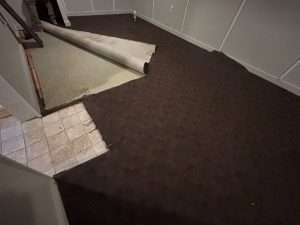 Basement with carpet pulled up