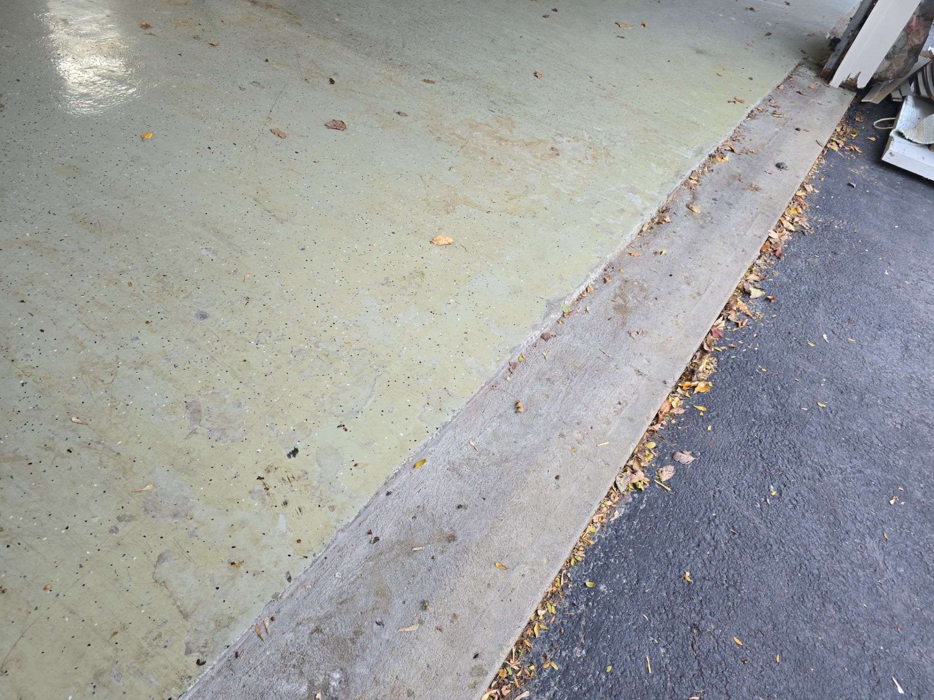 garage floor that had epoxy coating on it