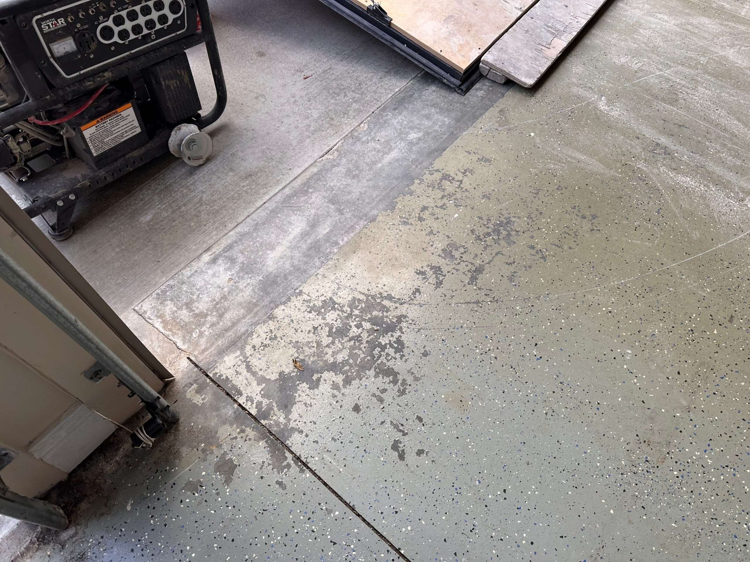 Garage floor that had epoxy coating on it