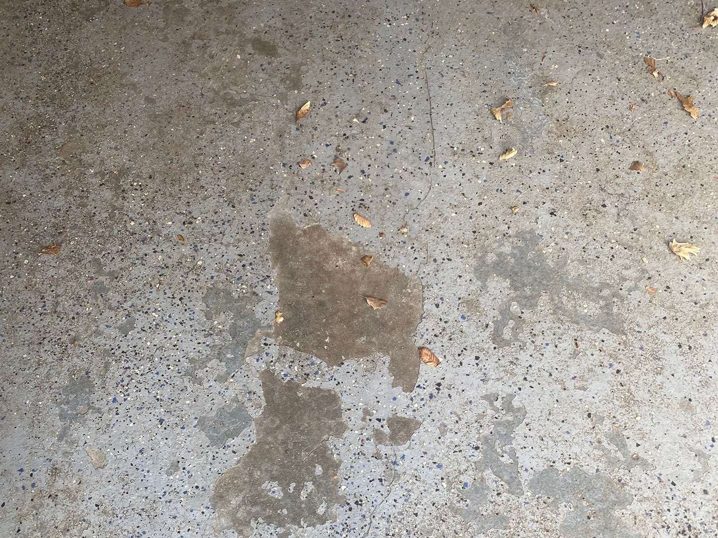 Garage floor that had epoxy coating on it
